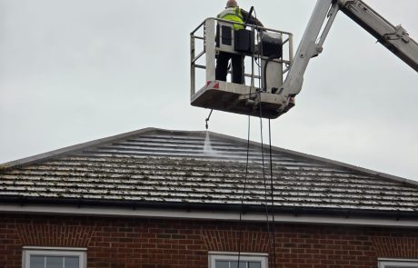 Mossy roof being pressure washed by Simple Clean team Mossy roof being pressure washed by Simple Clean team