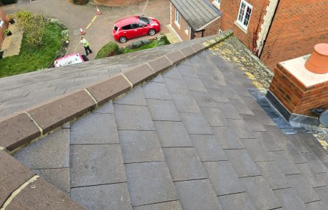 Before and after of roof being pressure washed Before and after of roof being pressure washed